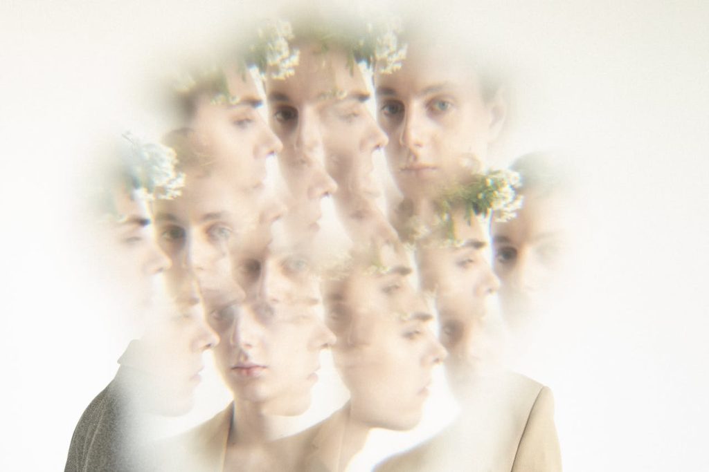 Abstract multi-exposure portrait of a man with multiple overlapping faces, symbolizing inconsistent decisions caused by a lack of personal philosophy.