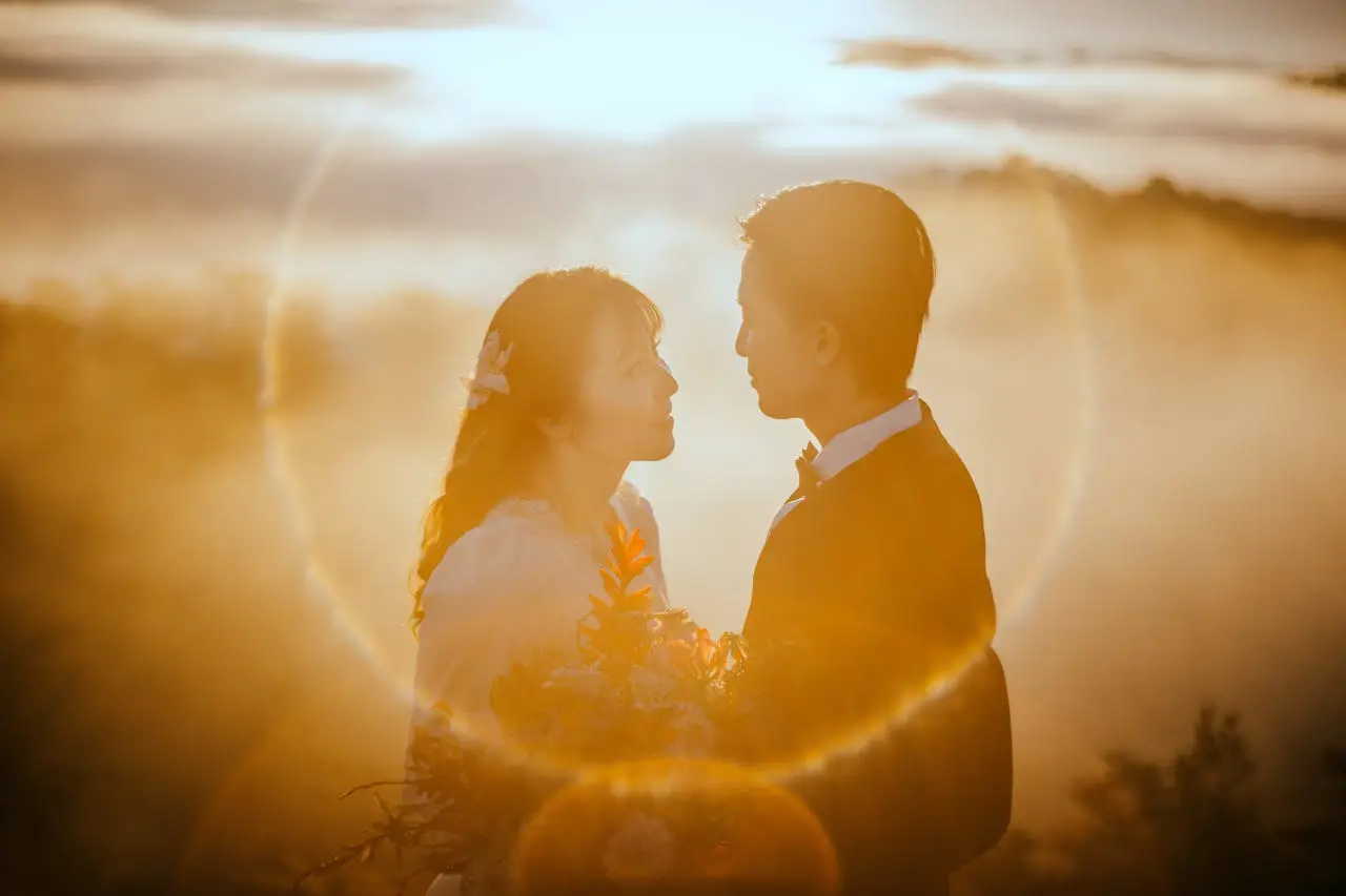 Couple standing together in warm sunlight, symbolizing harmony, unity, and the complementary relationship between masculine and feminine energy.