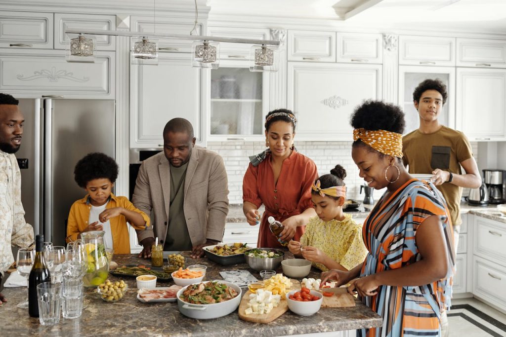 Family sharing a meal together at home, expressing spiritual leadership at home through shared values, presence, and connection.