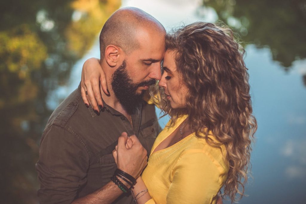 Man and woman sharing a close, intimate moment, showing the emotional depth and connection that comes from mature masculinity.