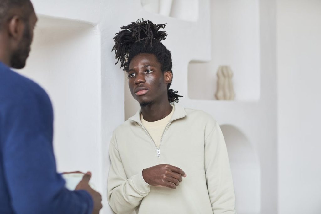 Man having an open, emotionally present conversation, illustrating healthy masculinity beyond toxic masculinity norms.